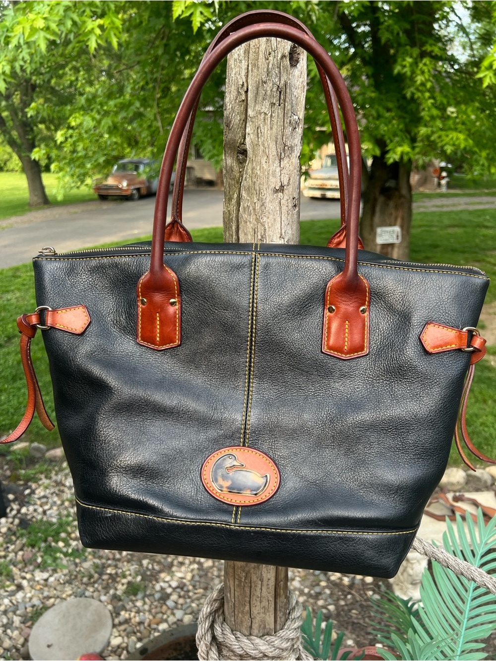 Dooney & Bourke Black Leather Tote with Brown Trim and Duck Logo